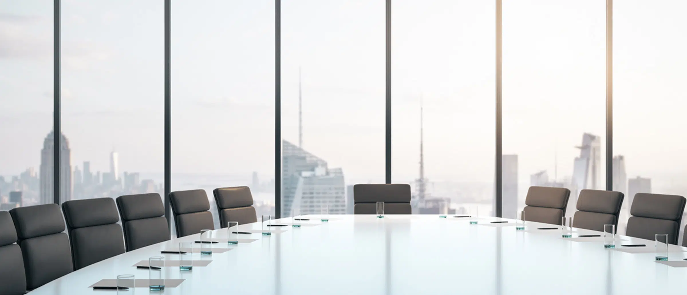 Empty professional conference room with big glass window with city skyline in the back